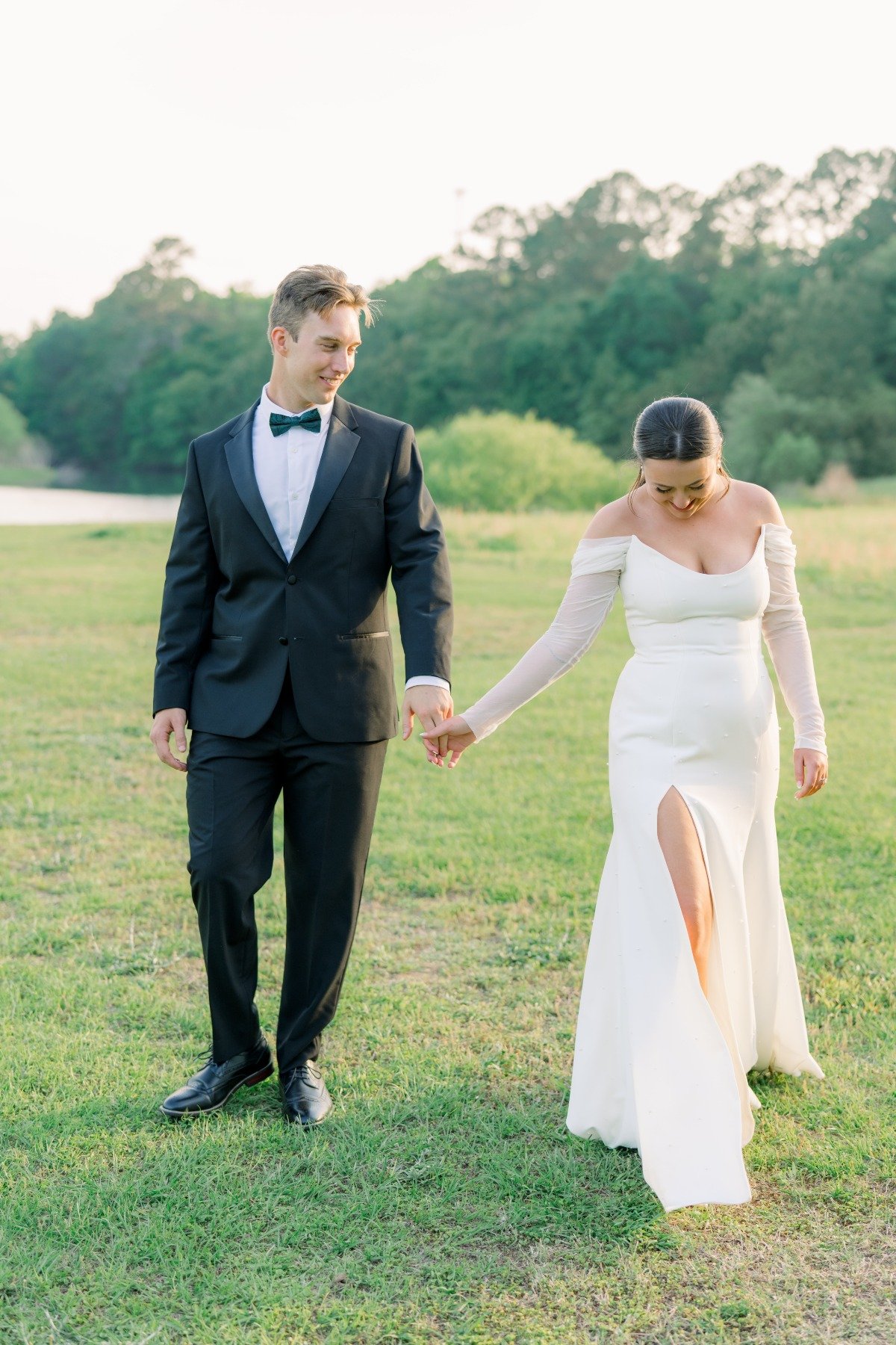 bride and groom walking at outdoor wedding venue