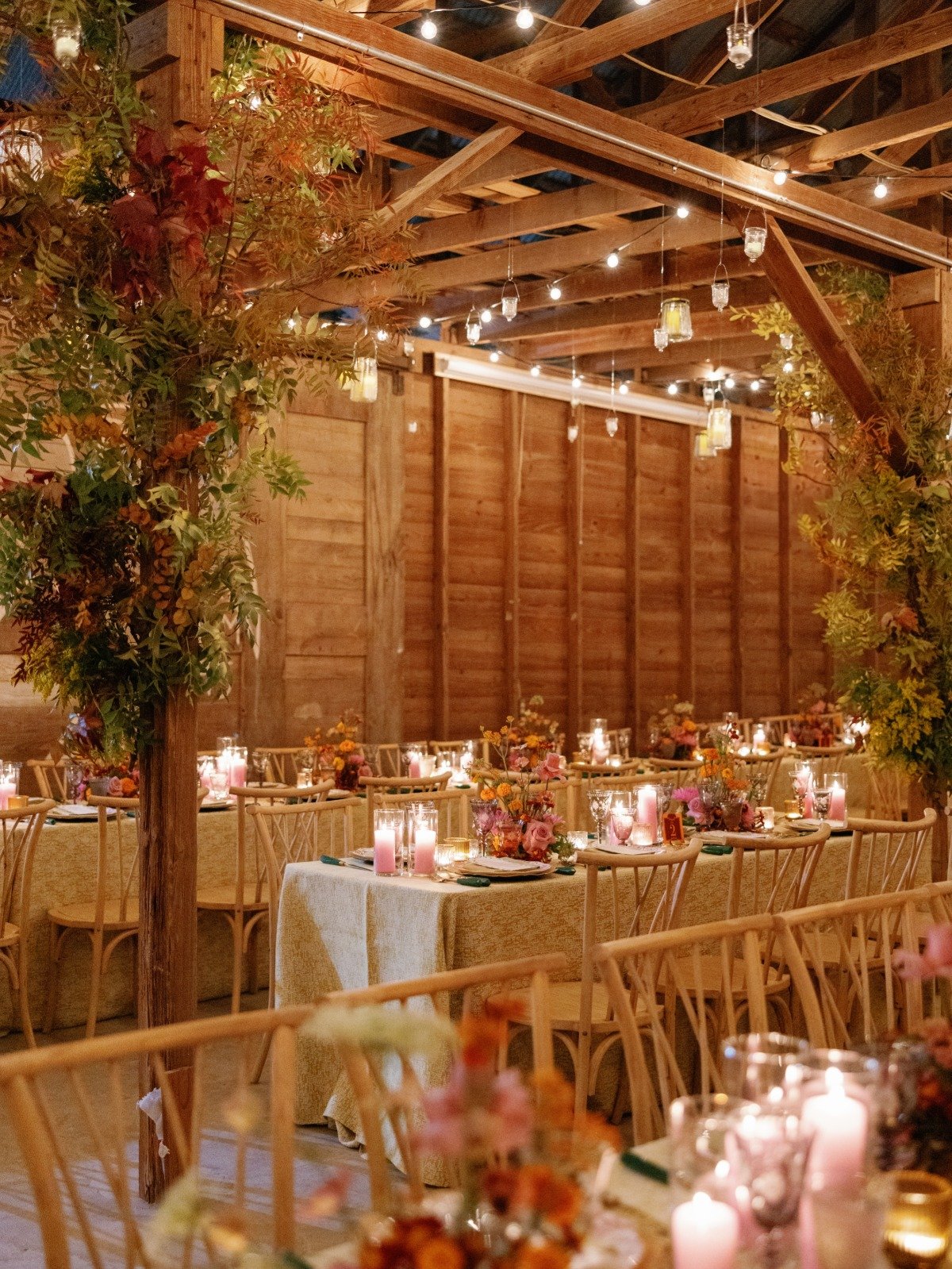 pink yellow and orange wedding in a wood barn