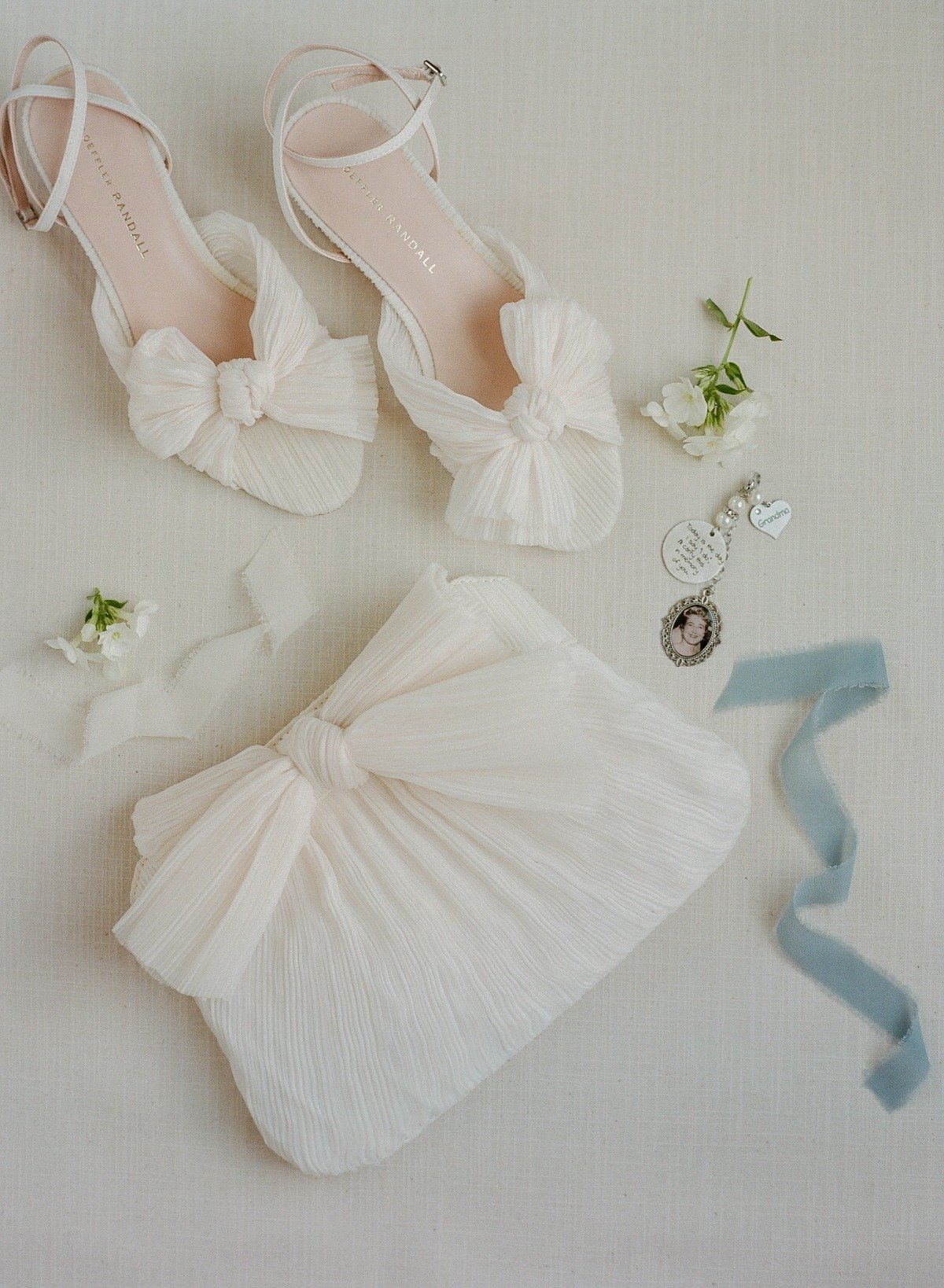 white pleated wedding shoes with matching clutch