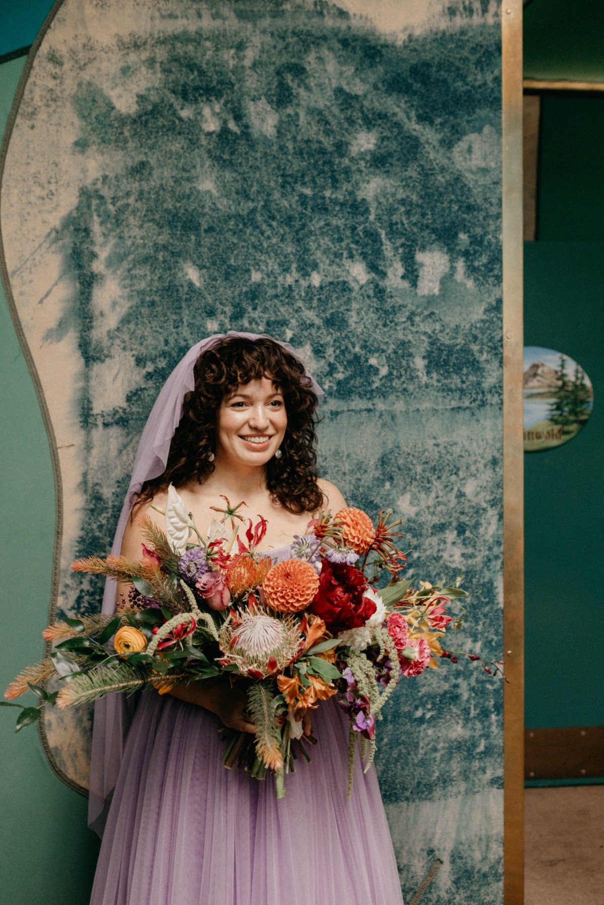 Colorful Bouquet With Bride Wearing Purple Gown