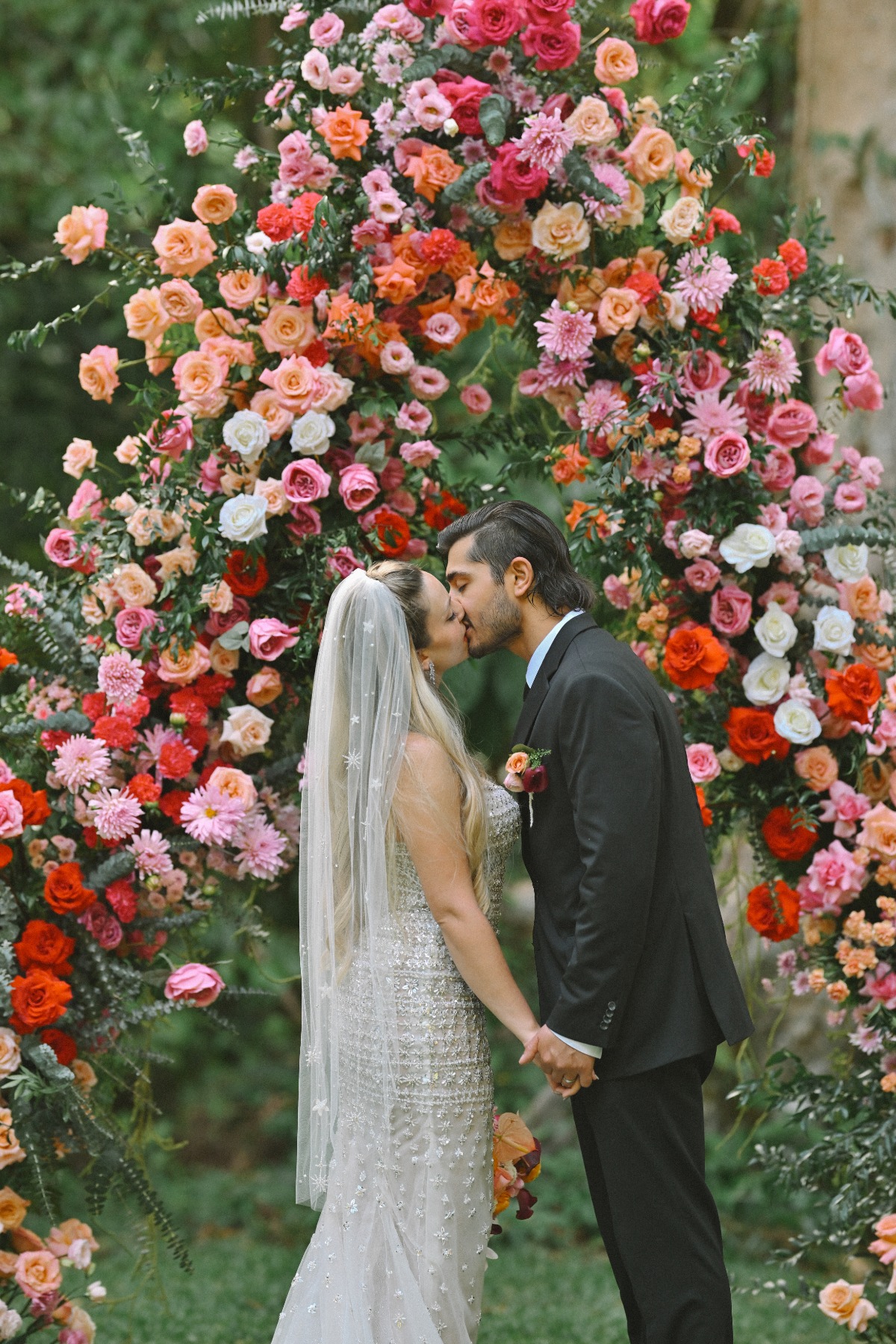 couple's first kiss during wedding ceremony