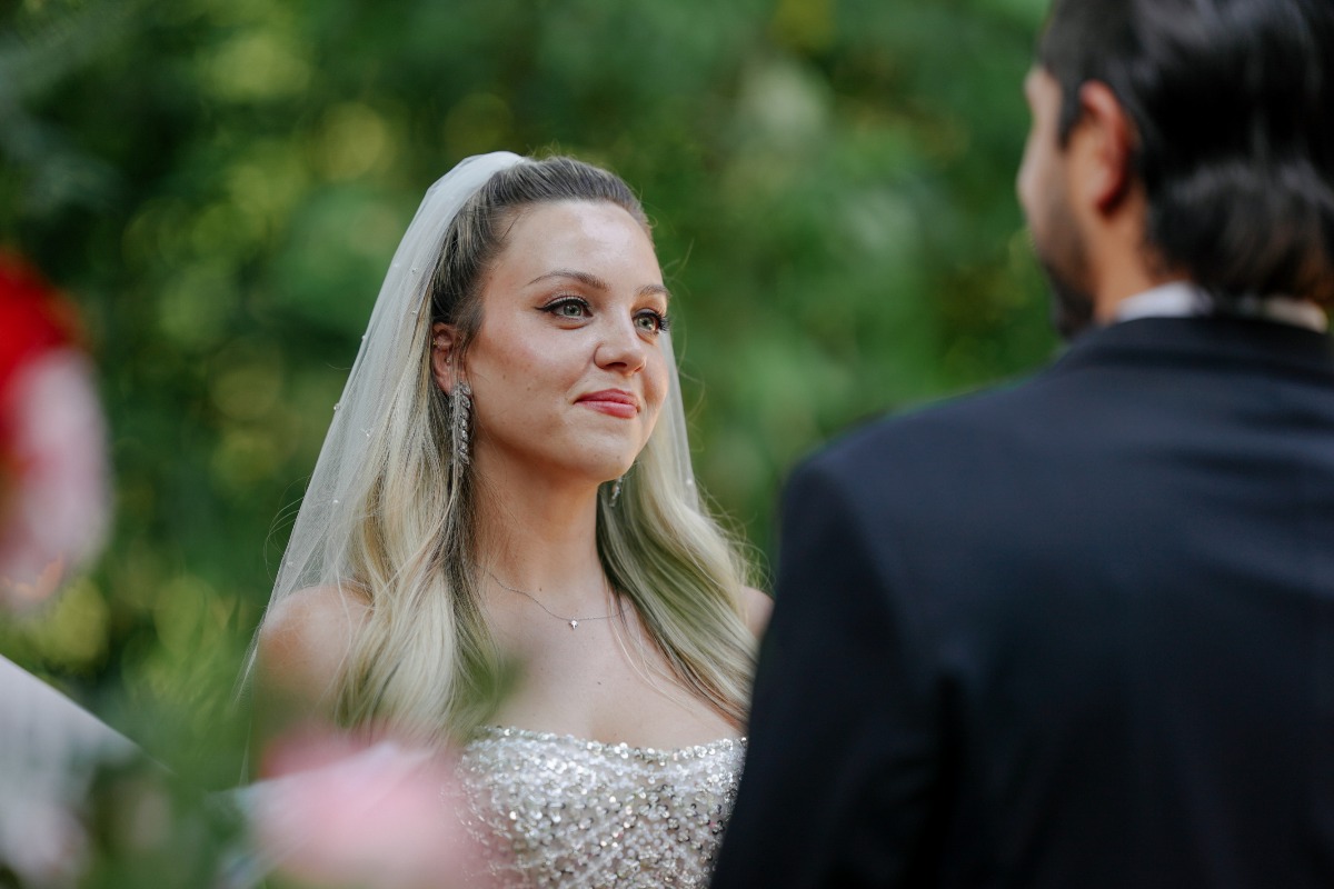 bride during ceremony listening to husband's vowx