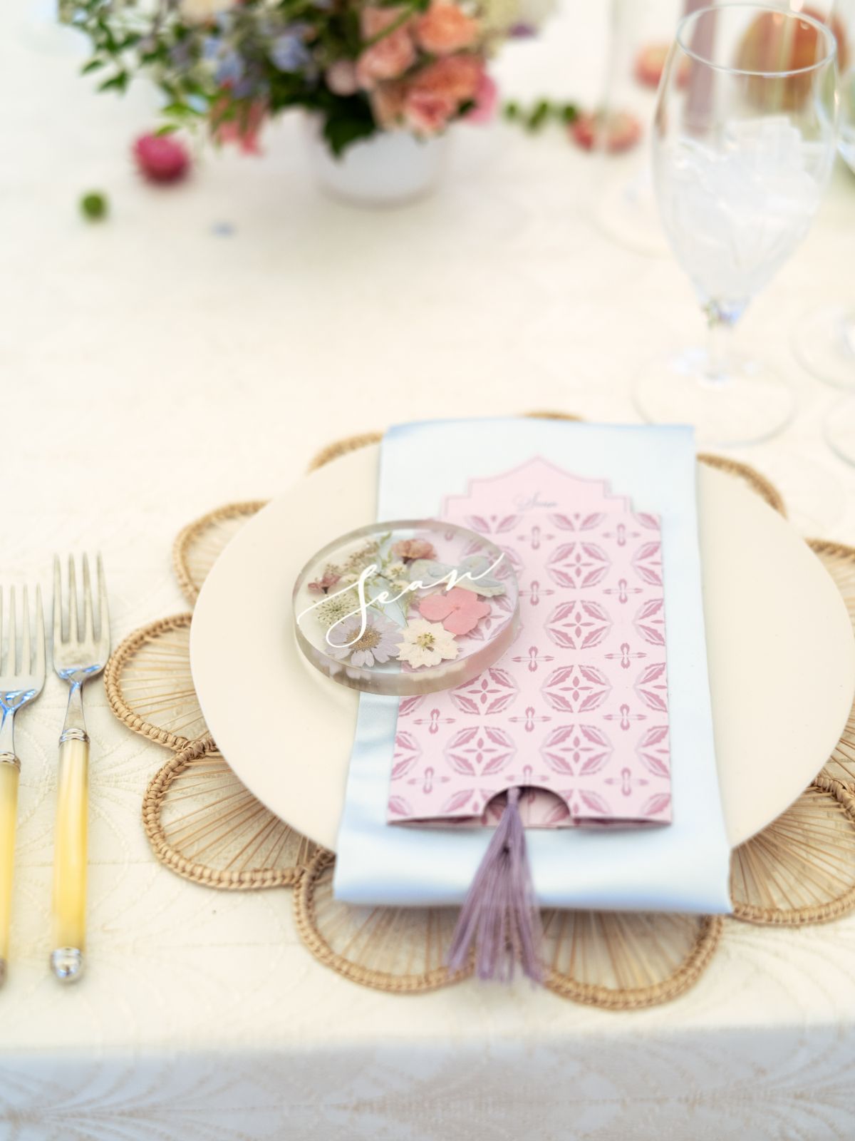 tasseled wedding menu with resin and pressed flower place cards