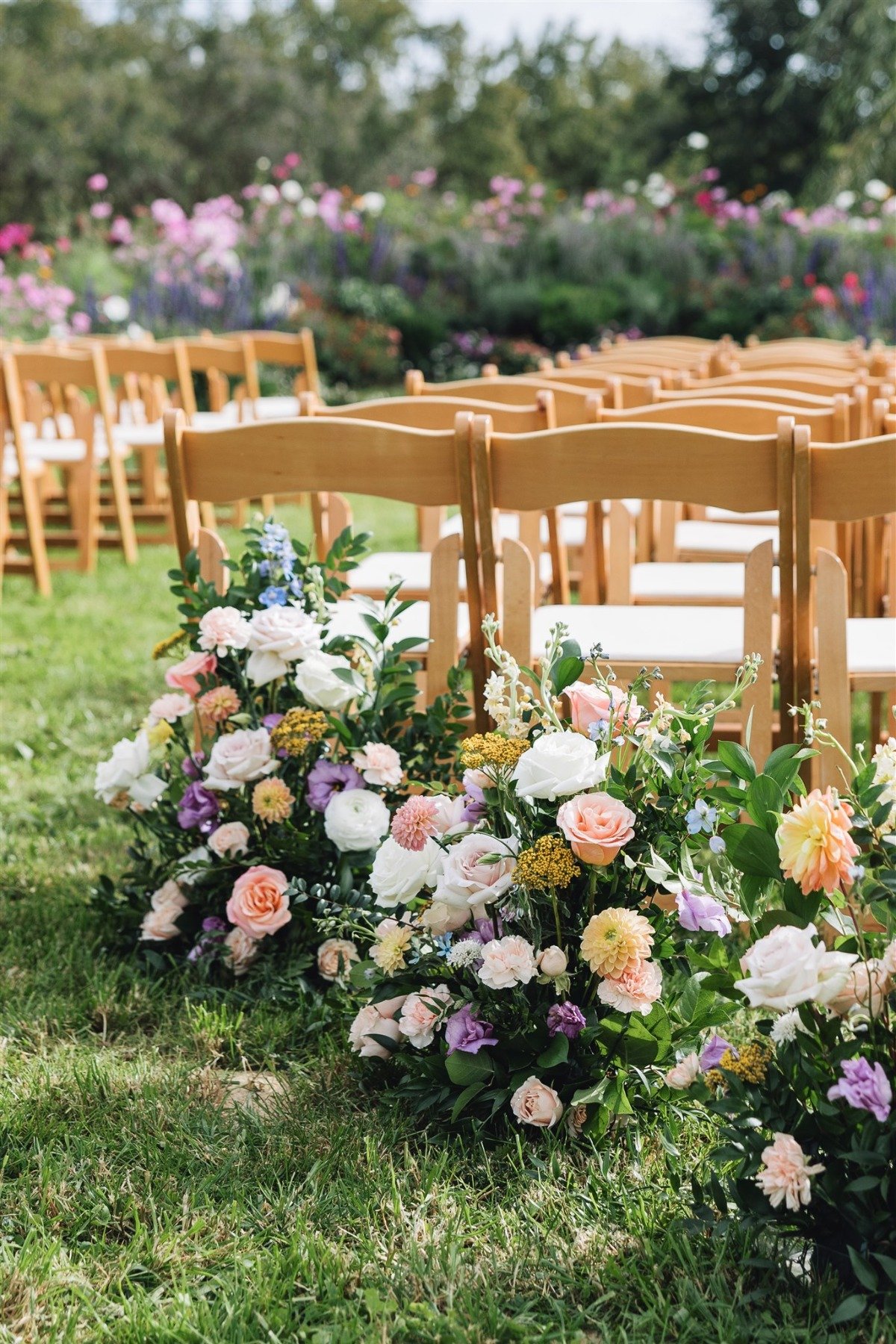 pastel colored flowers at outdoor wedding ceremony