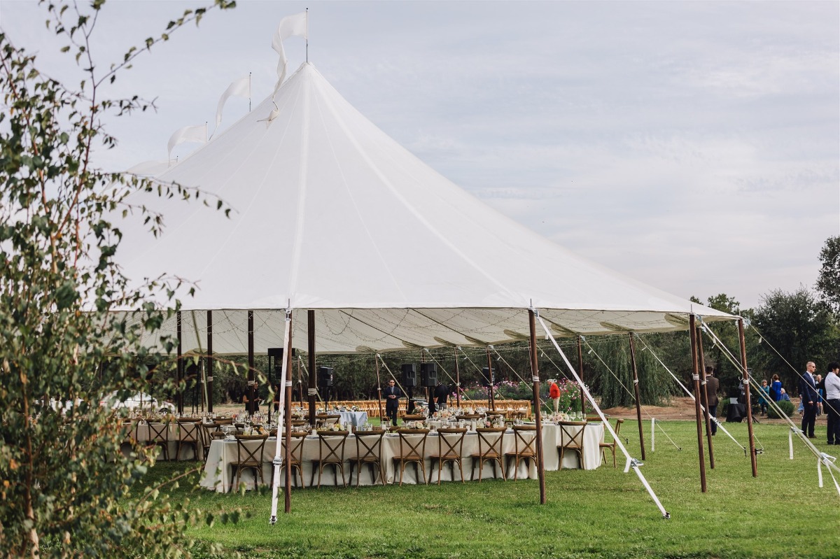 tented wedding reception in a backyard