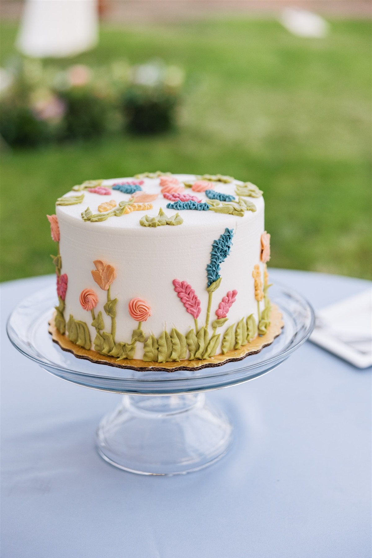 simple wildflower buttercream wedding cake