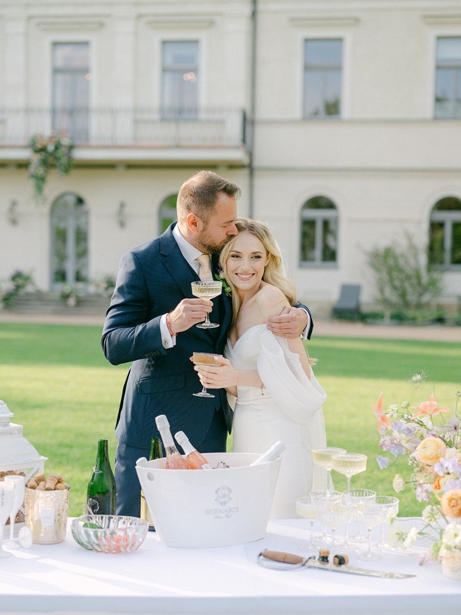 Bottles popped at this lilac chateau wedding in the Czech Republic