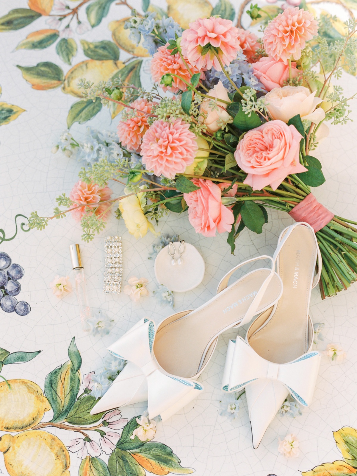 blue and white pointed toe wedding shoes with bouquet