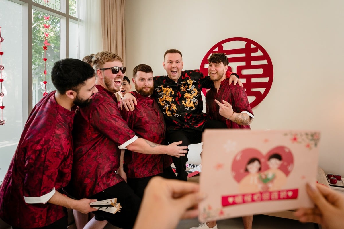 groom and groomsmen at chinese tea ceremony