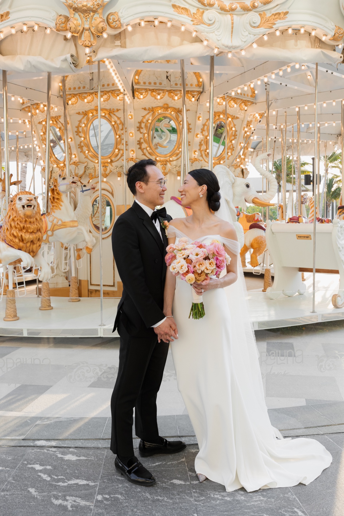 wedding venue in cancun with a white and gold carousel