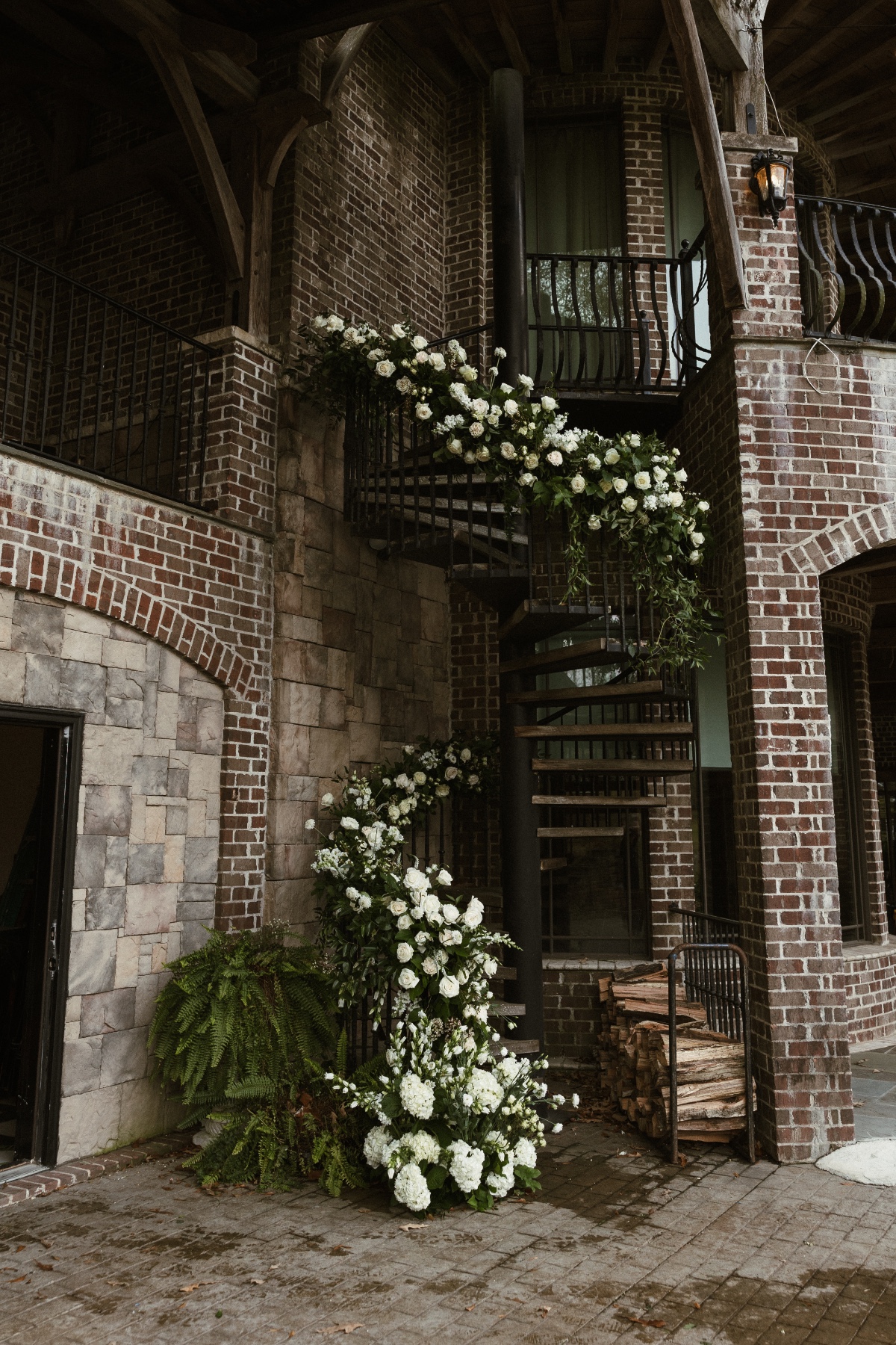 white rose flower installation on spiral staircase