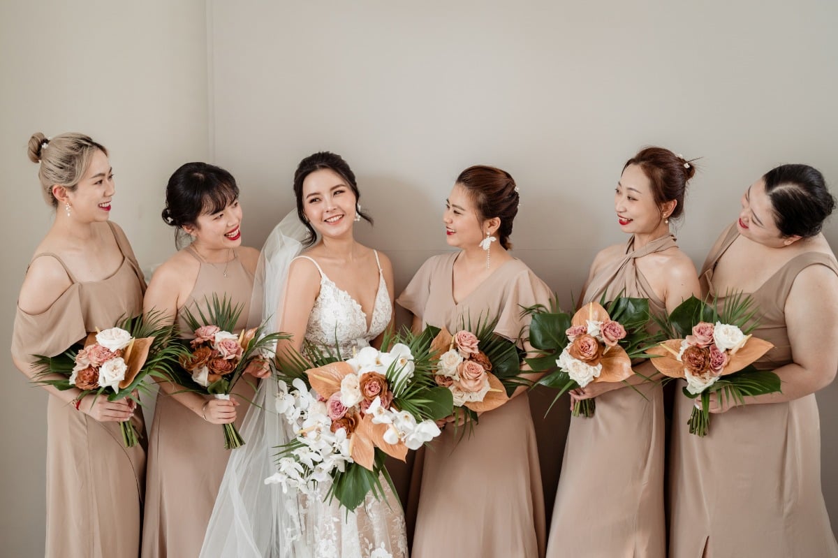 bridesmaids in khaki and bride in white lace