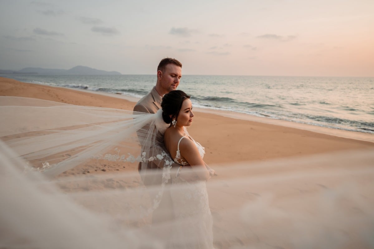 bride and groom on beach at thiland destination wedding