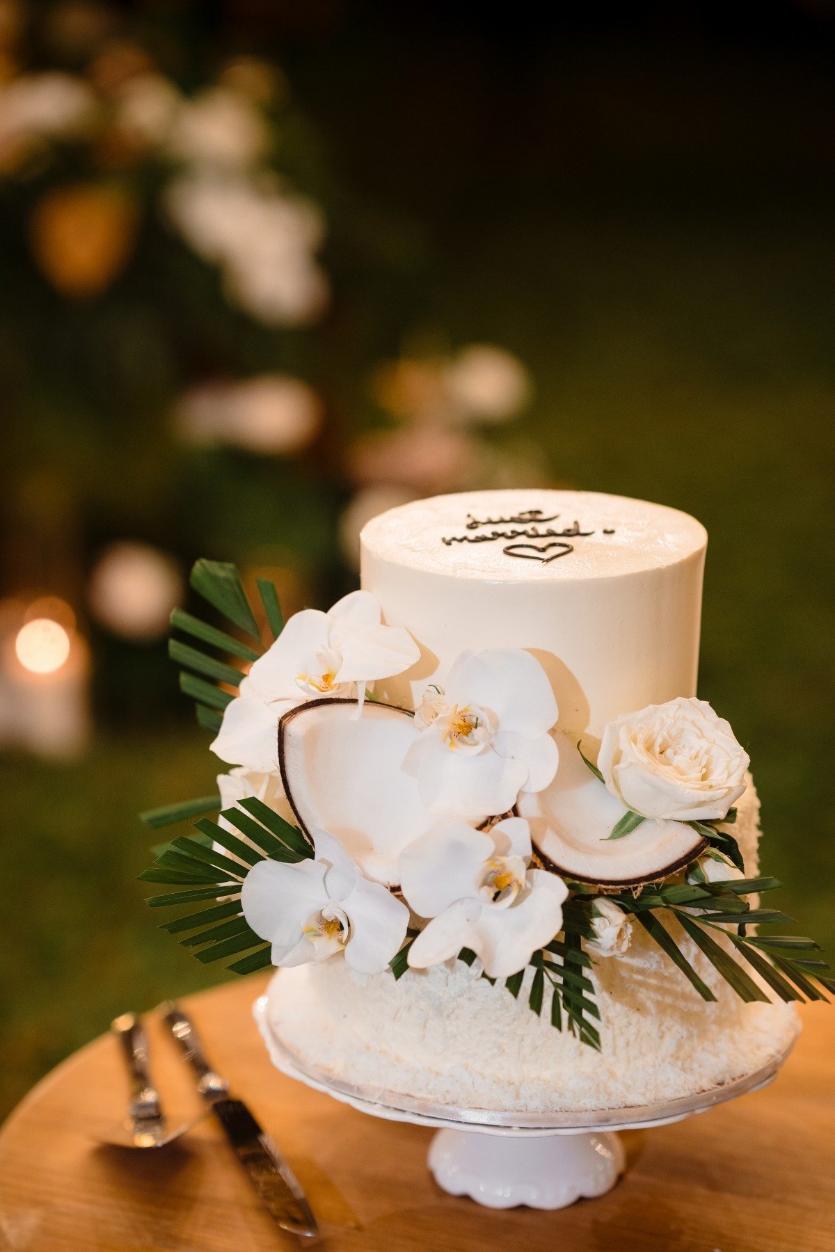 small wedding cake with orchids and coconut