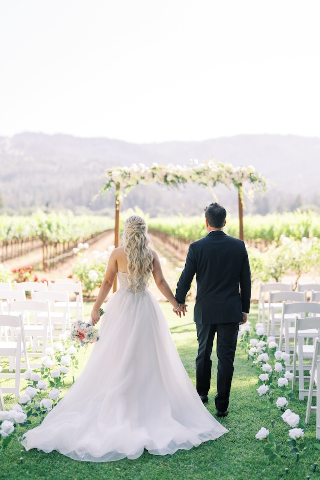 bride and groom at ceremony at napa valley vineyard