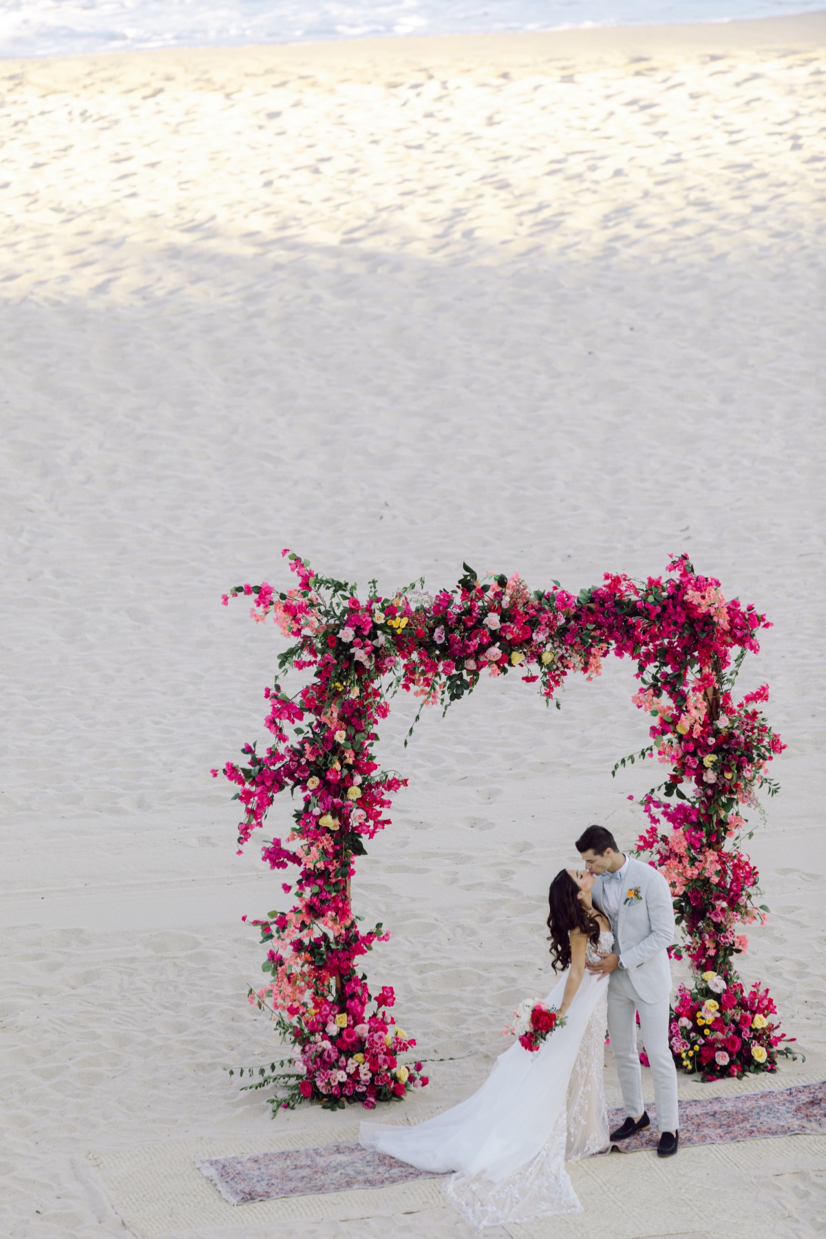 fuchsia wedding floral arch for ceremony