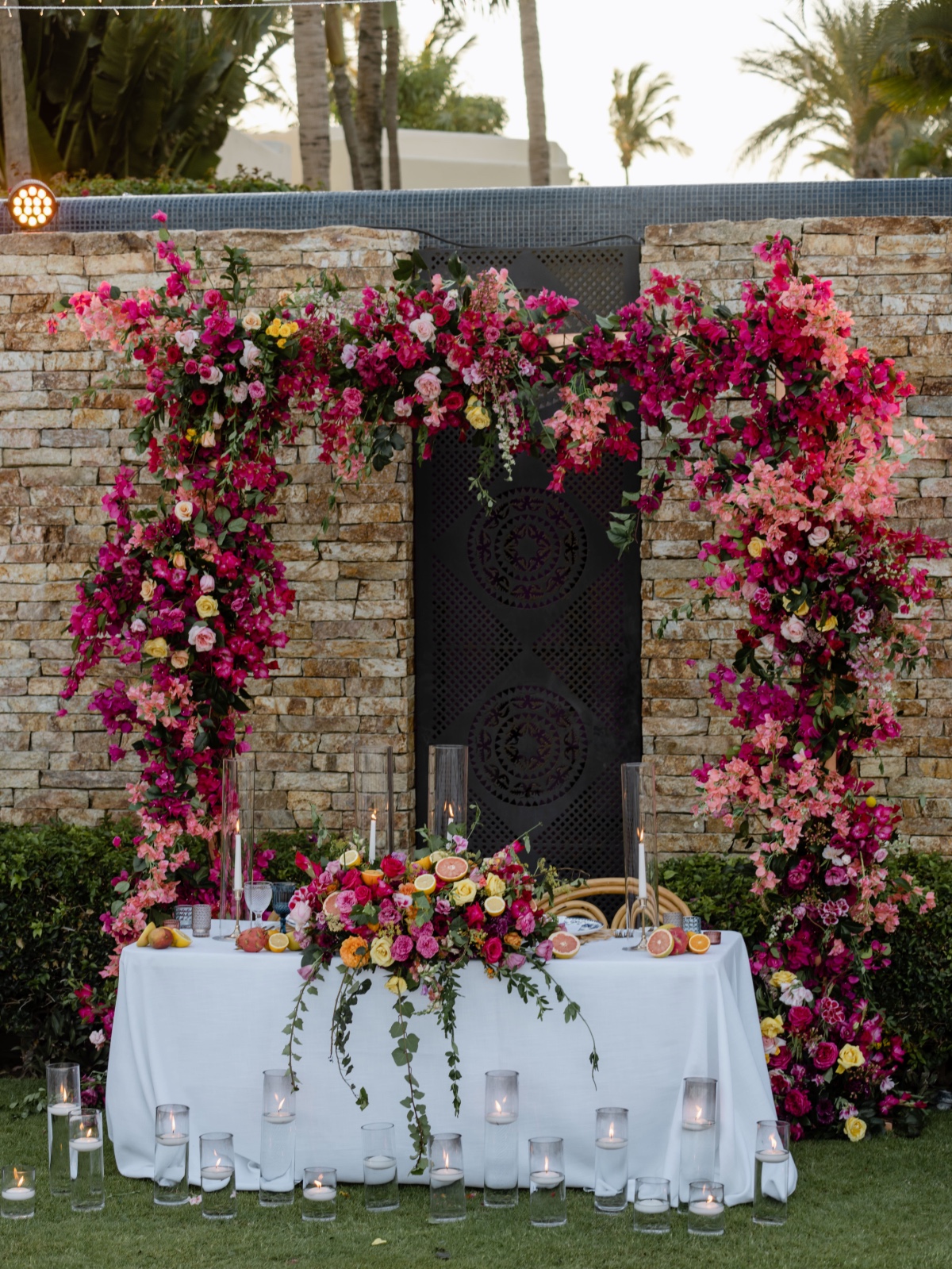 fuchsia wedding arch for sweetheart table