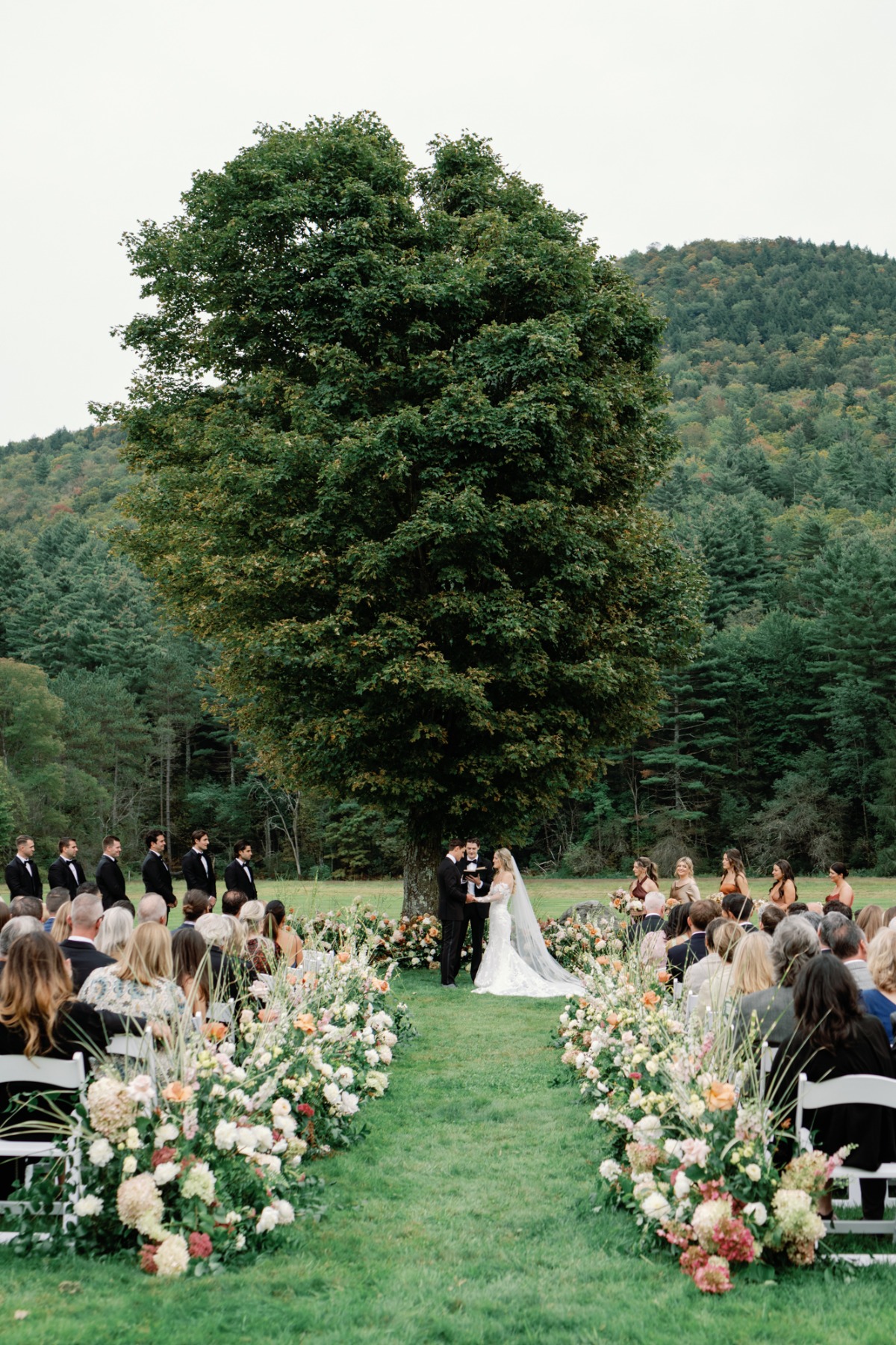 outdoor garden wedding ceremony in peach and ivory