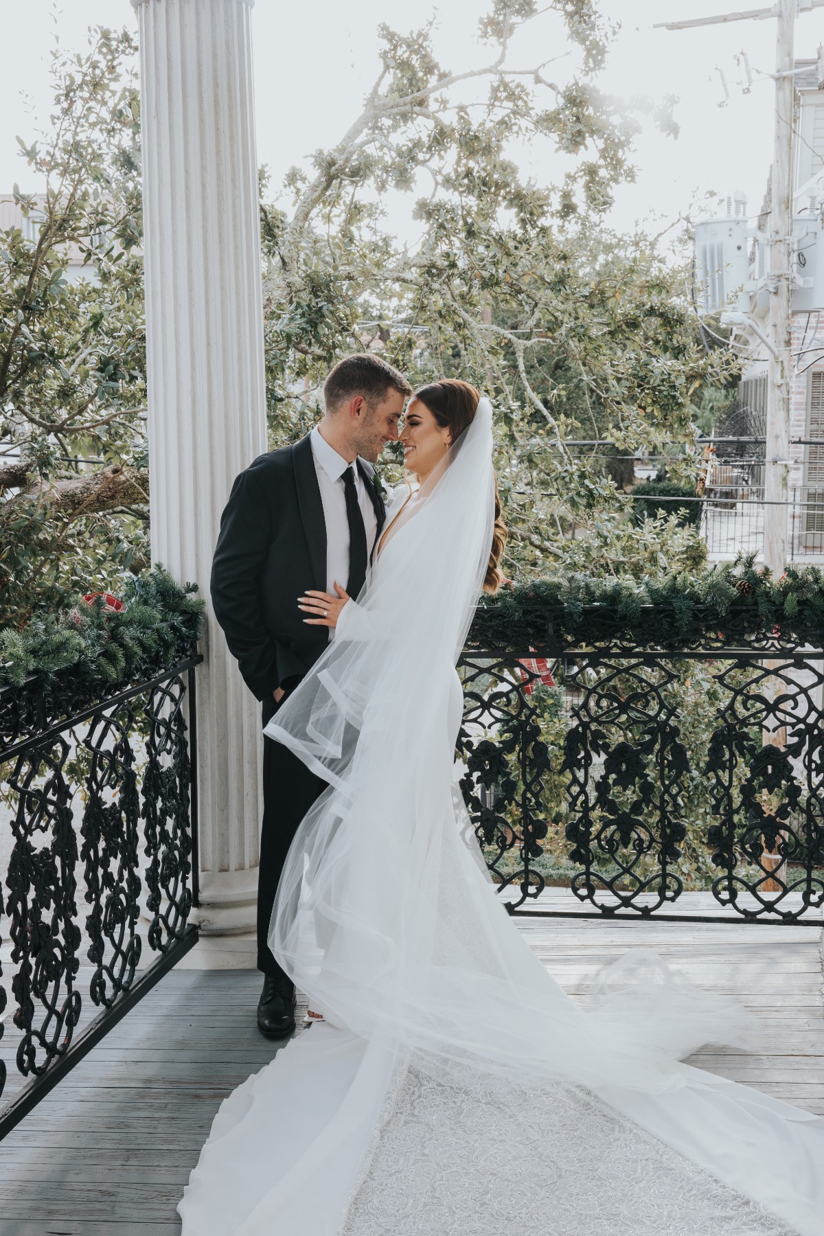 bride and groom on porch in new orleans wedding venue