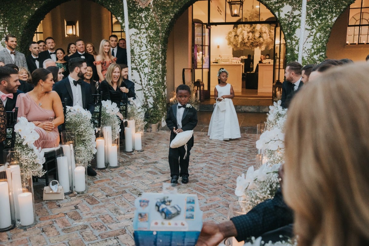 ring bearer and flower girl at courtyard wedding