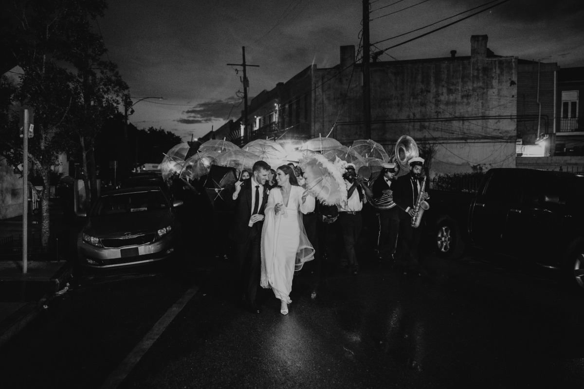 bride with feathered parasol for second line in new orleans