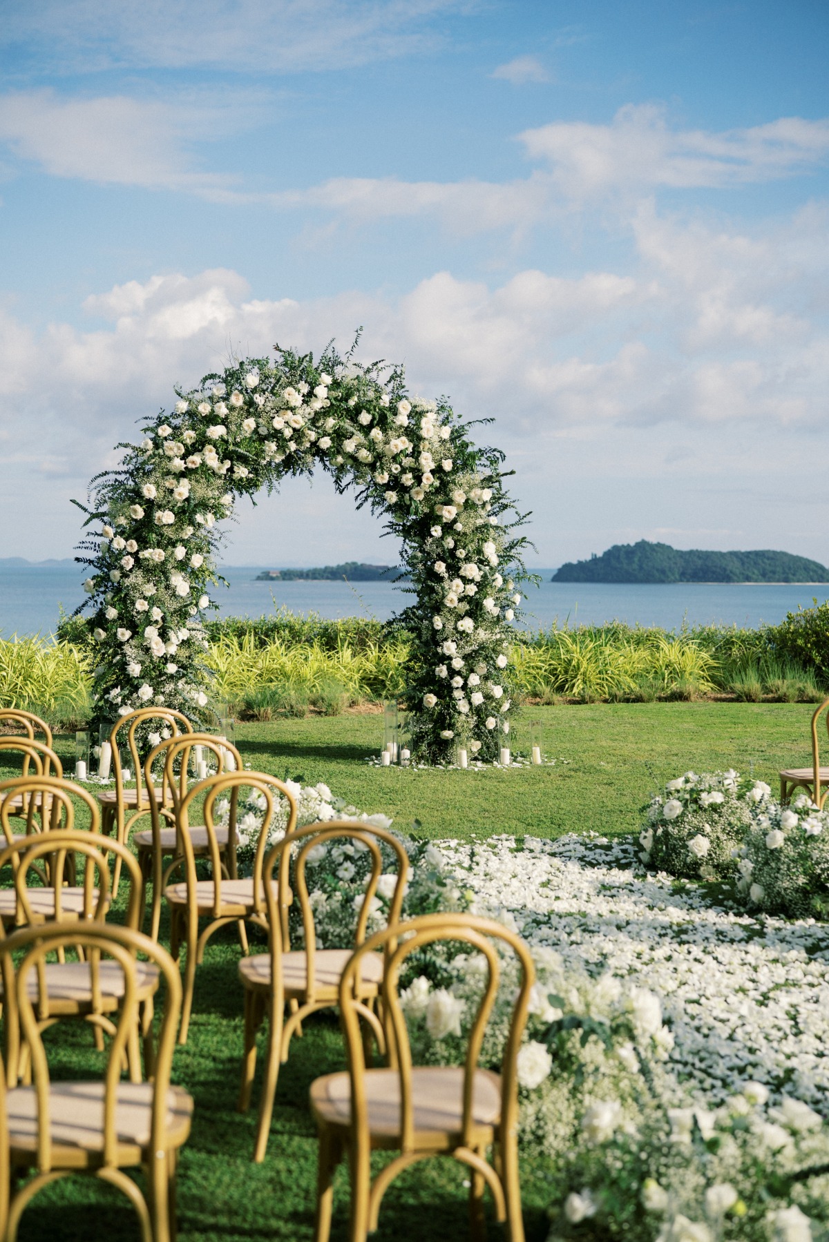 white rose floral arch for wedding ceremony