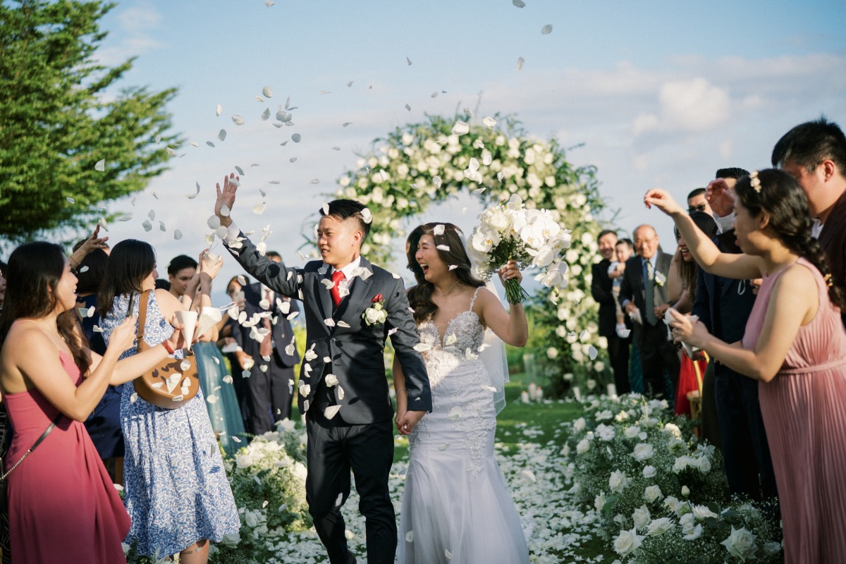 white petal exit at outdoor wedding ceremony