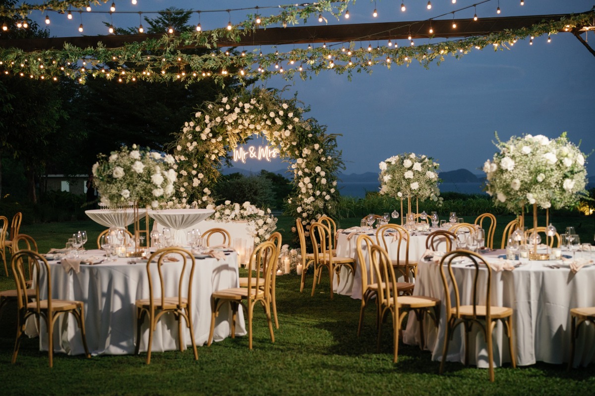 white flowers at outdoor wedding reception in thailand