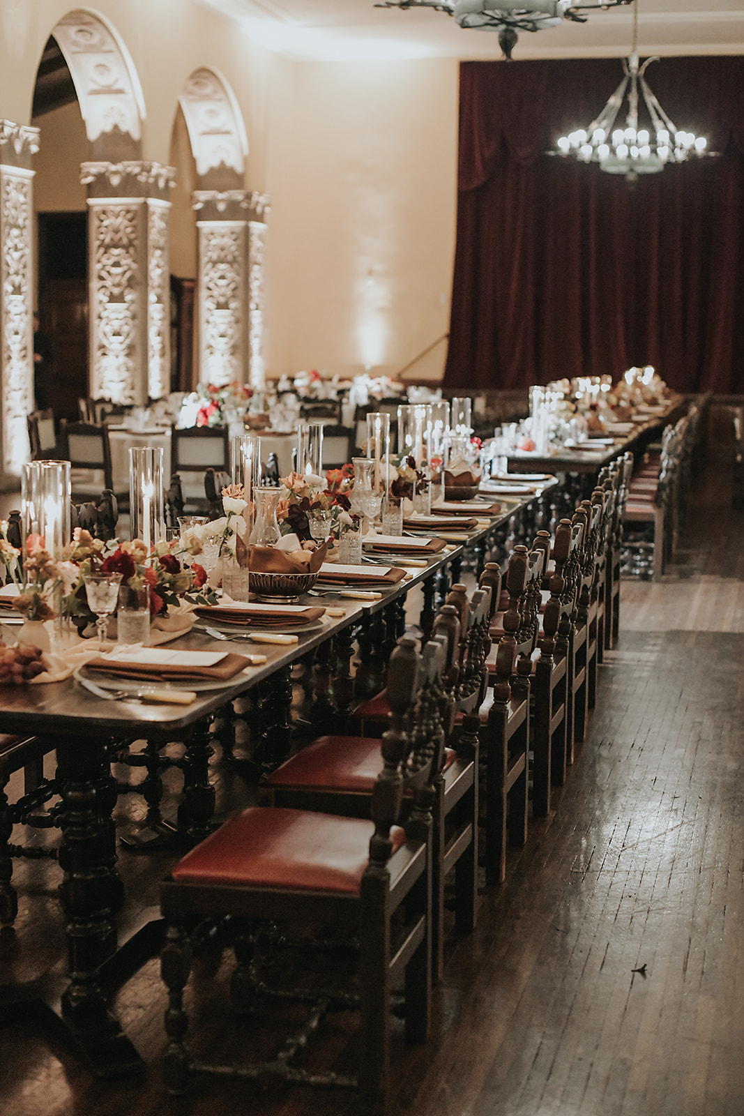 moody wood and burgundy wedding reception