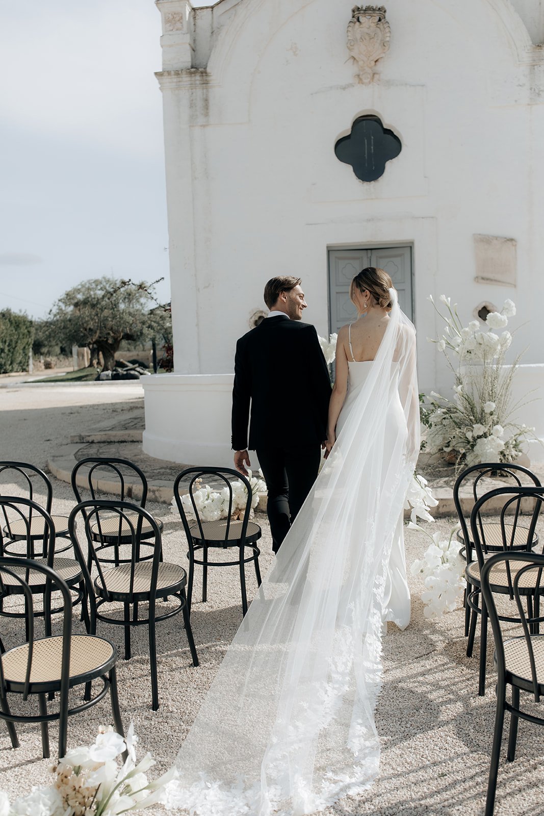 couple walking down the aisle at italian wedding