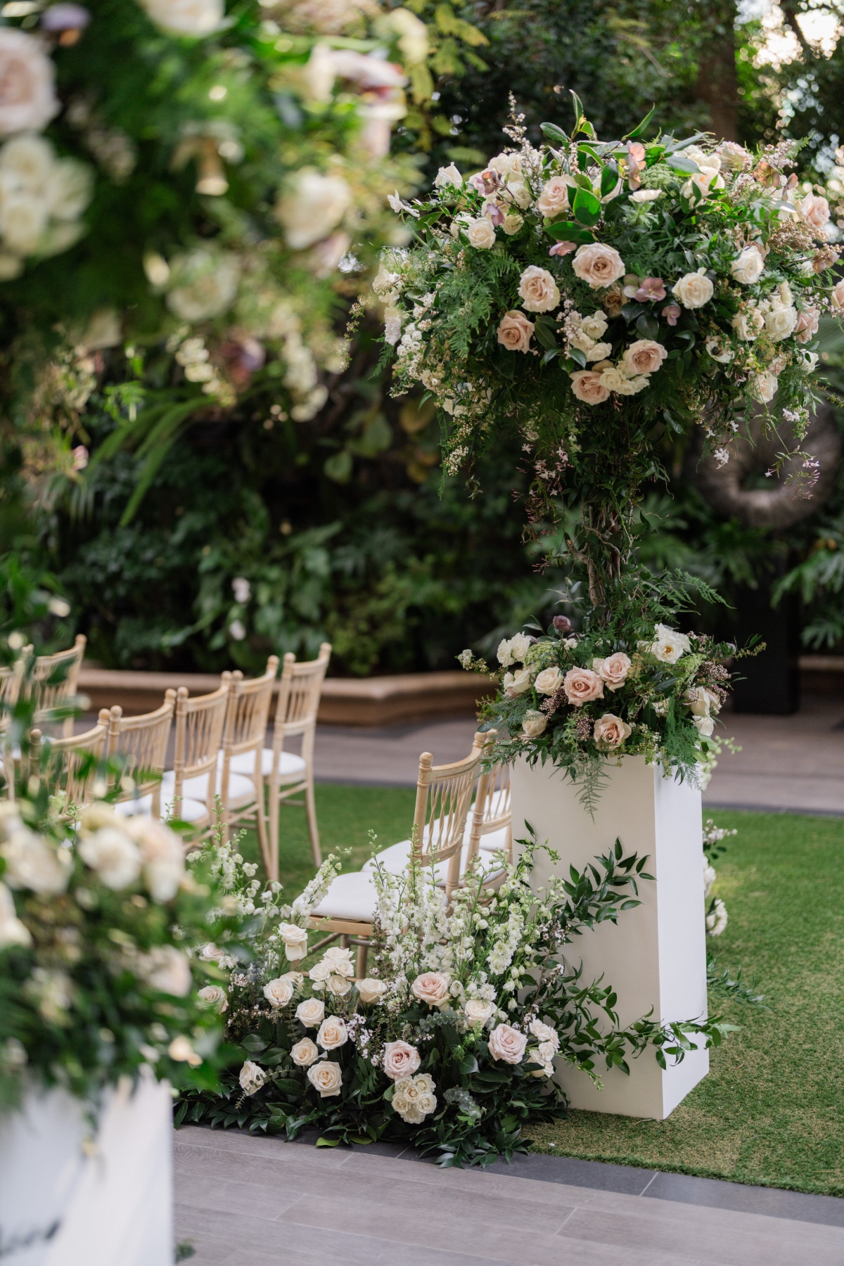 tall rose floral arrangements in blush and ivory