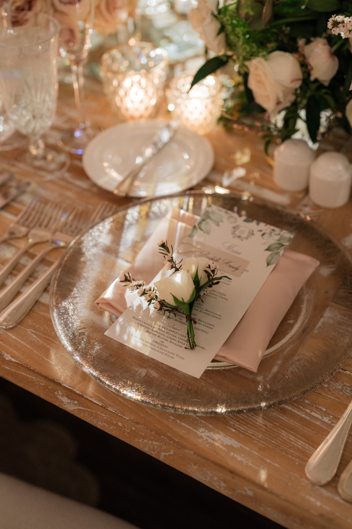 clear glass chargers with blush napkins