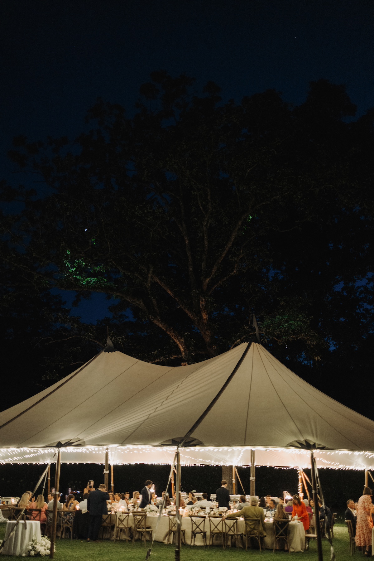 nighttime outdoor wedding tent