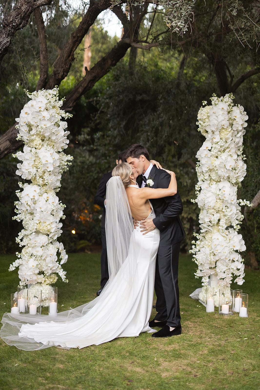 white floral pillars for outdoor wedding