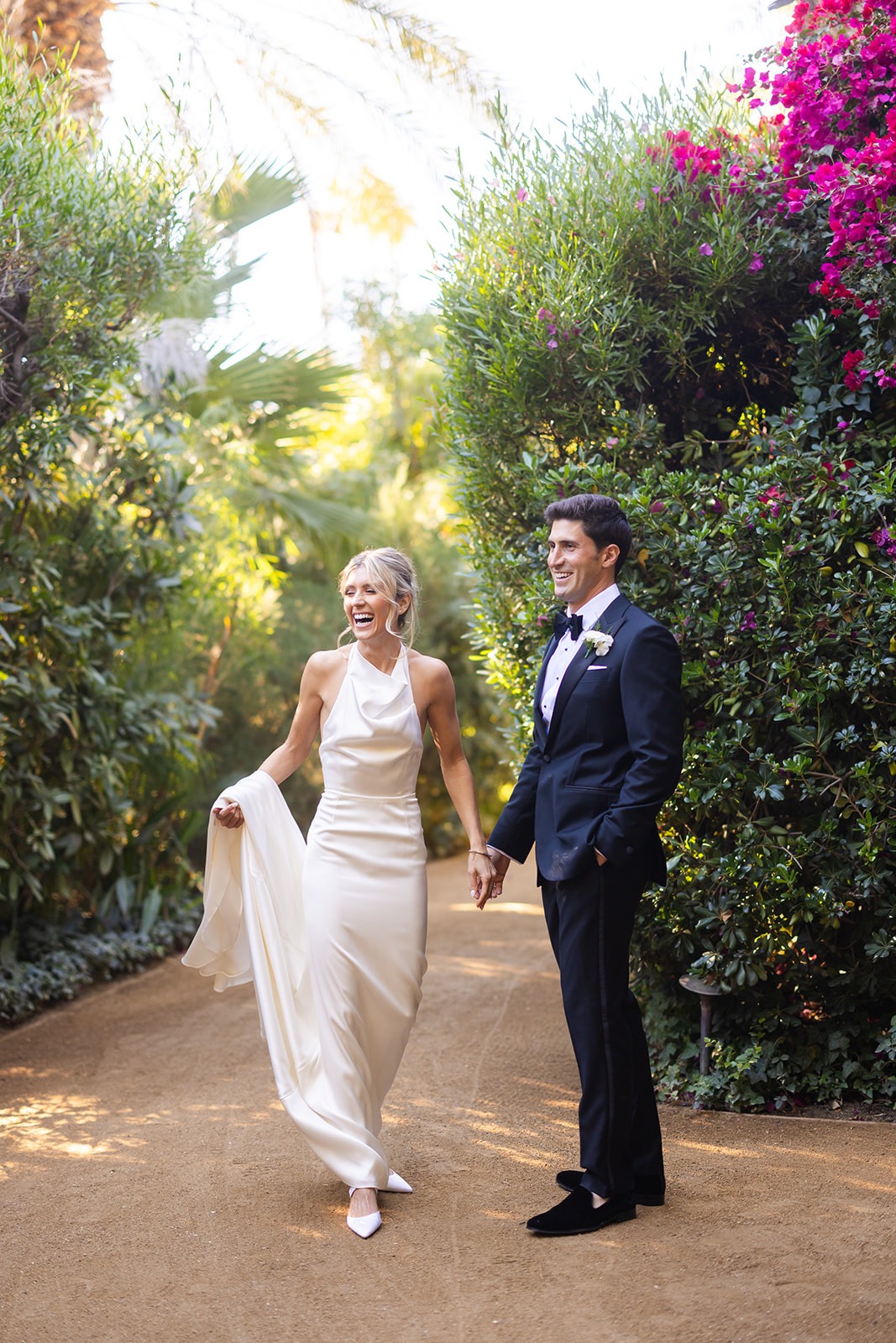 bride in halter wedding gown with groom in tuxedo