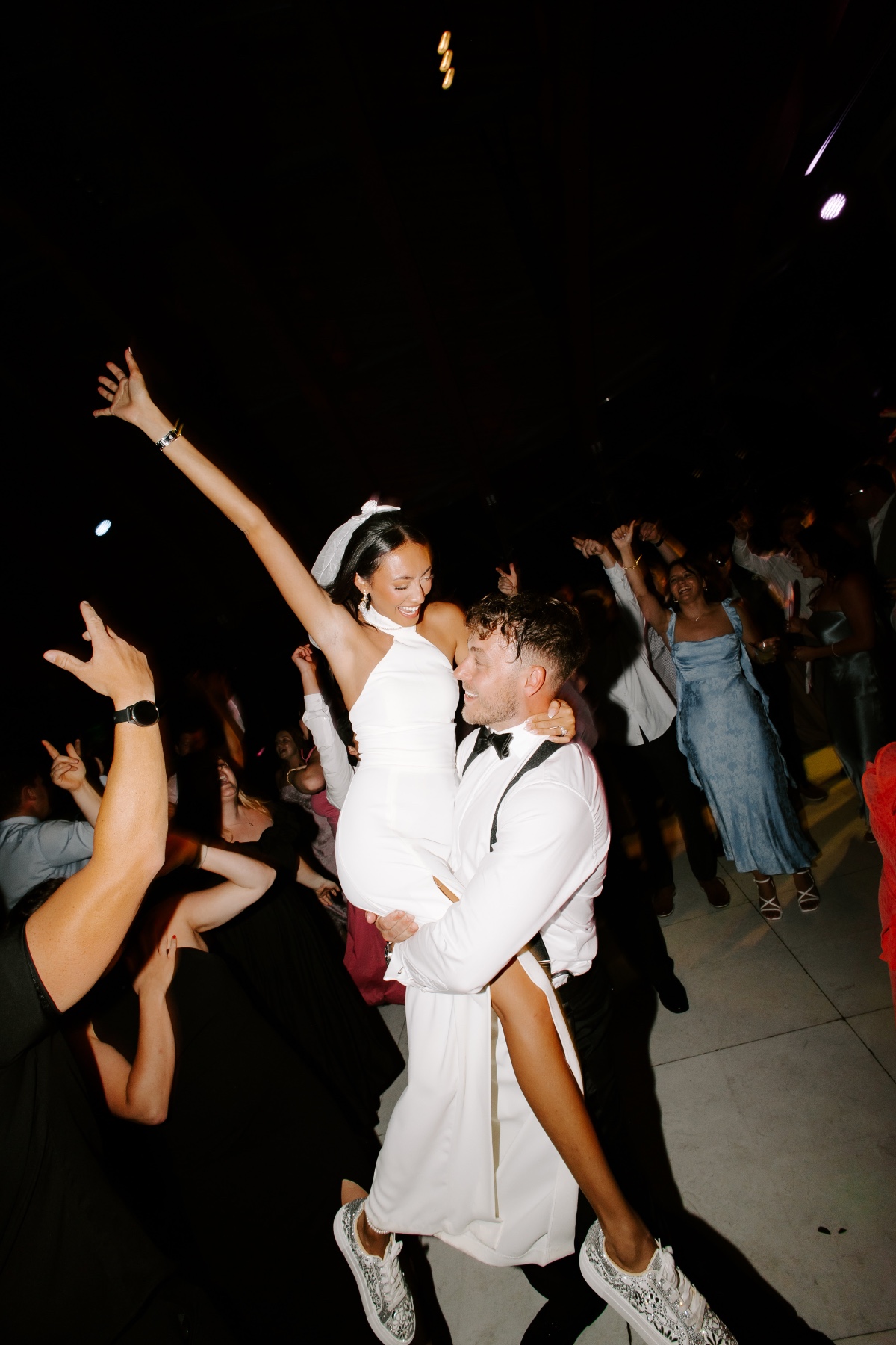 bride in halter reception dress with bow