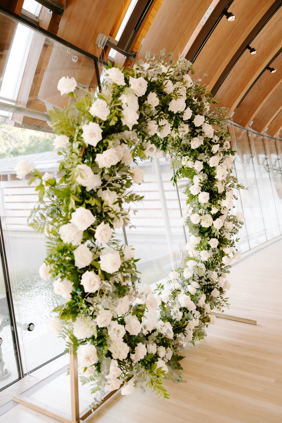 white rose circle floral arch for wedding ceremony