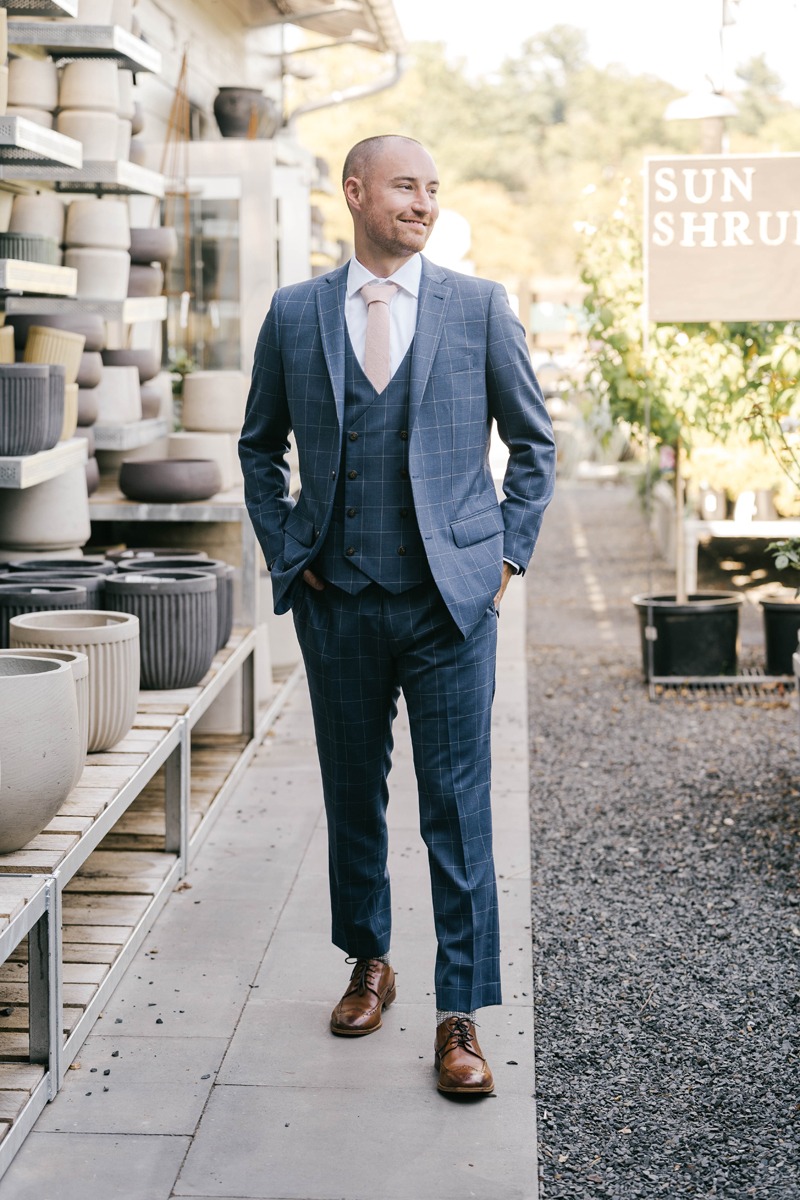 groom in 3 piece blue suit for wedding