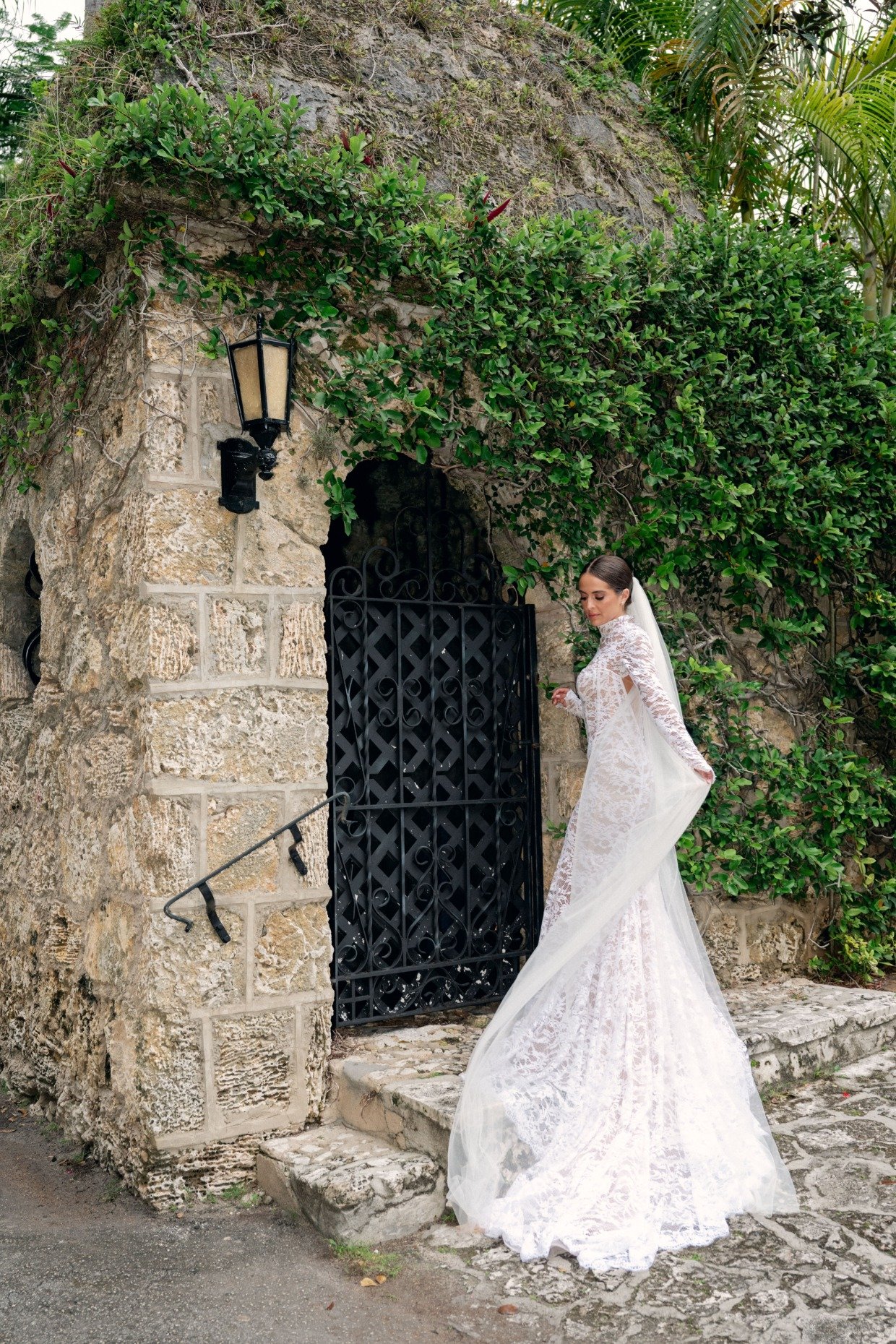 bride in galia lahav long sleeve mermaid gown with veil