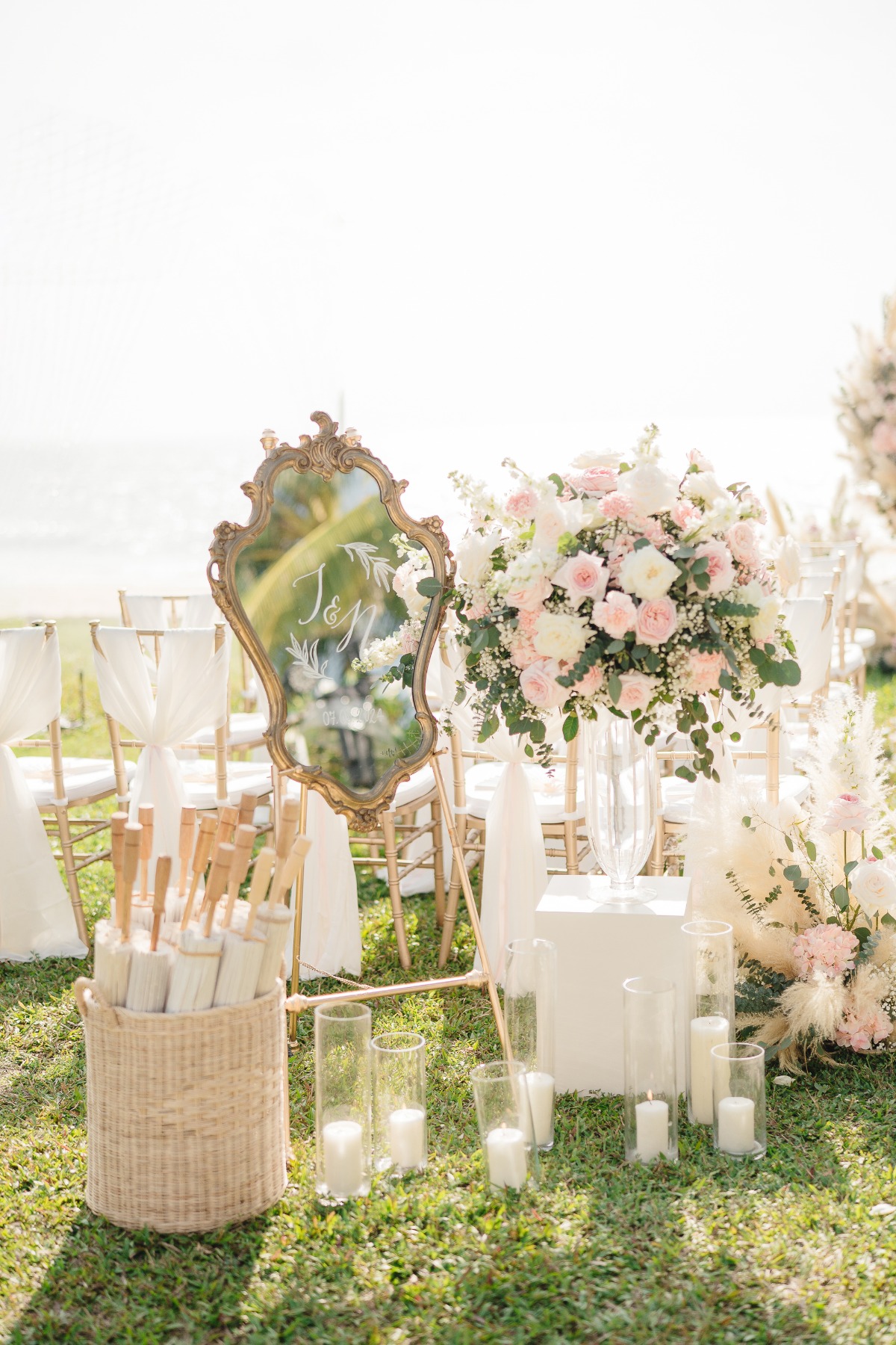 mirrored welcome sign and basket of parasols