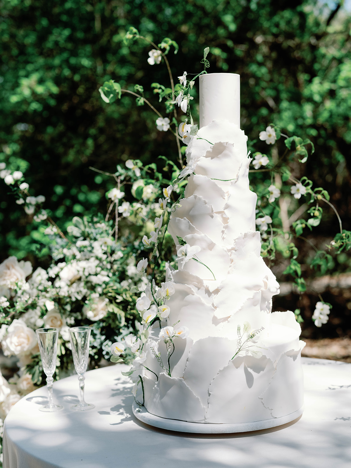 tall tiered wedding cake with organic fondant petals