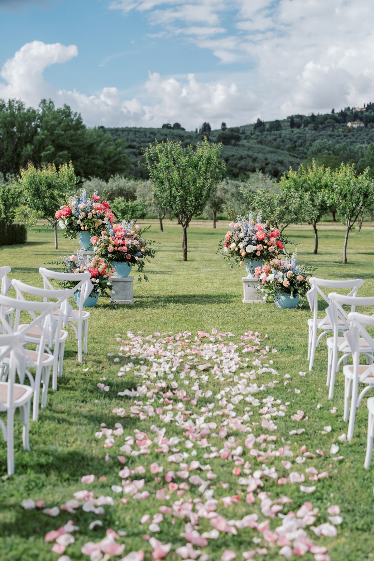 pink peach and blue wedding flowers at ceremony