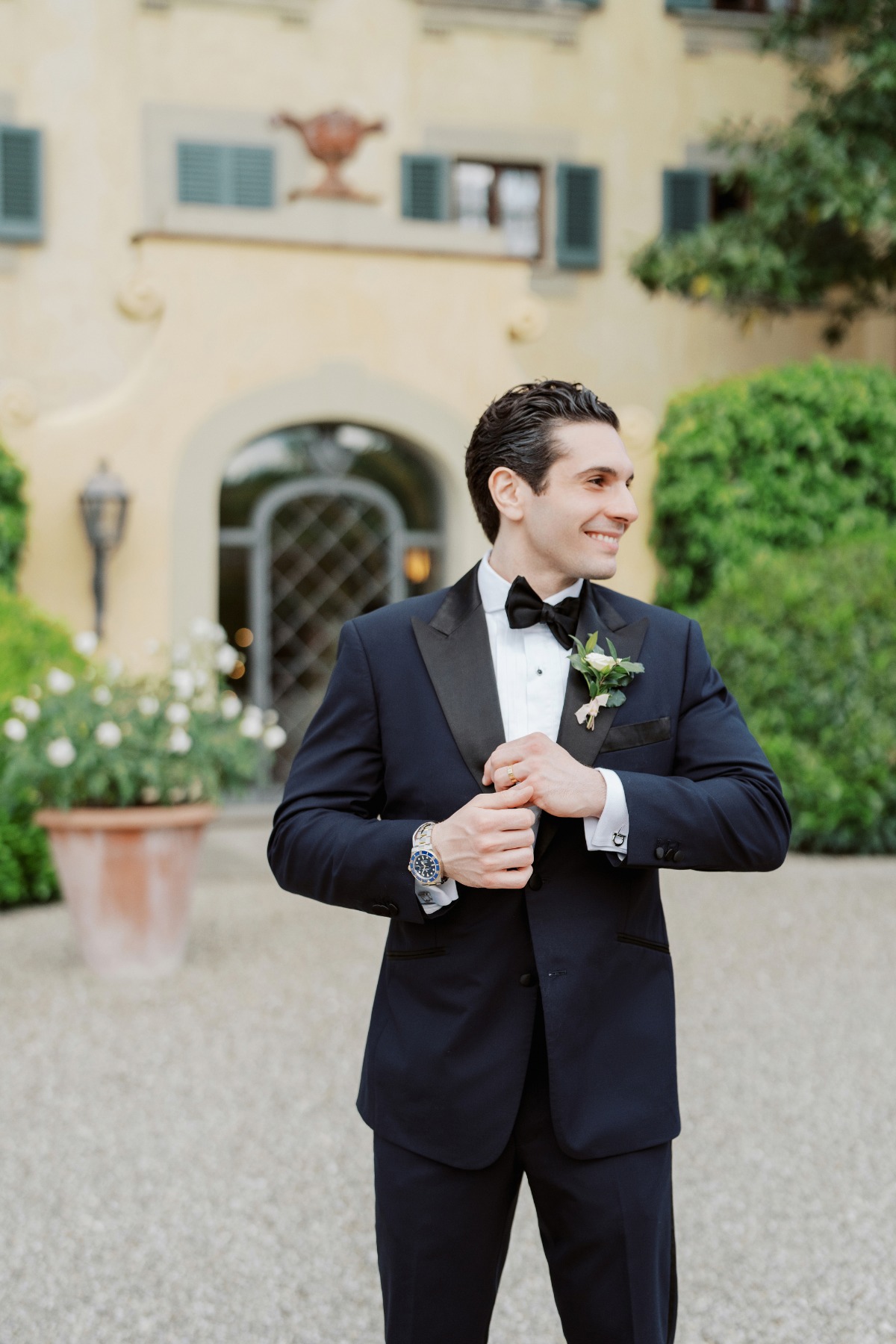 groom in custom navy blue tuxedo