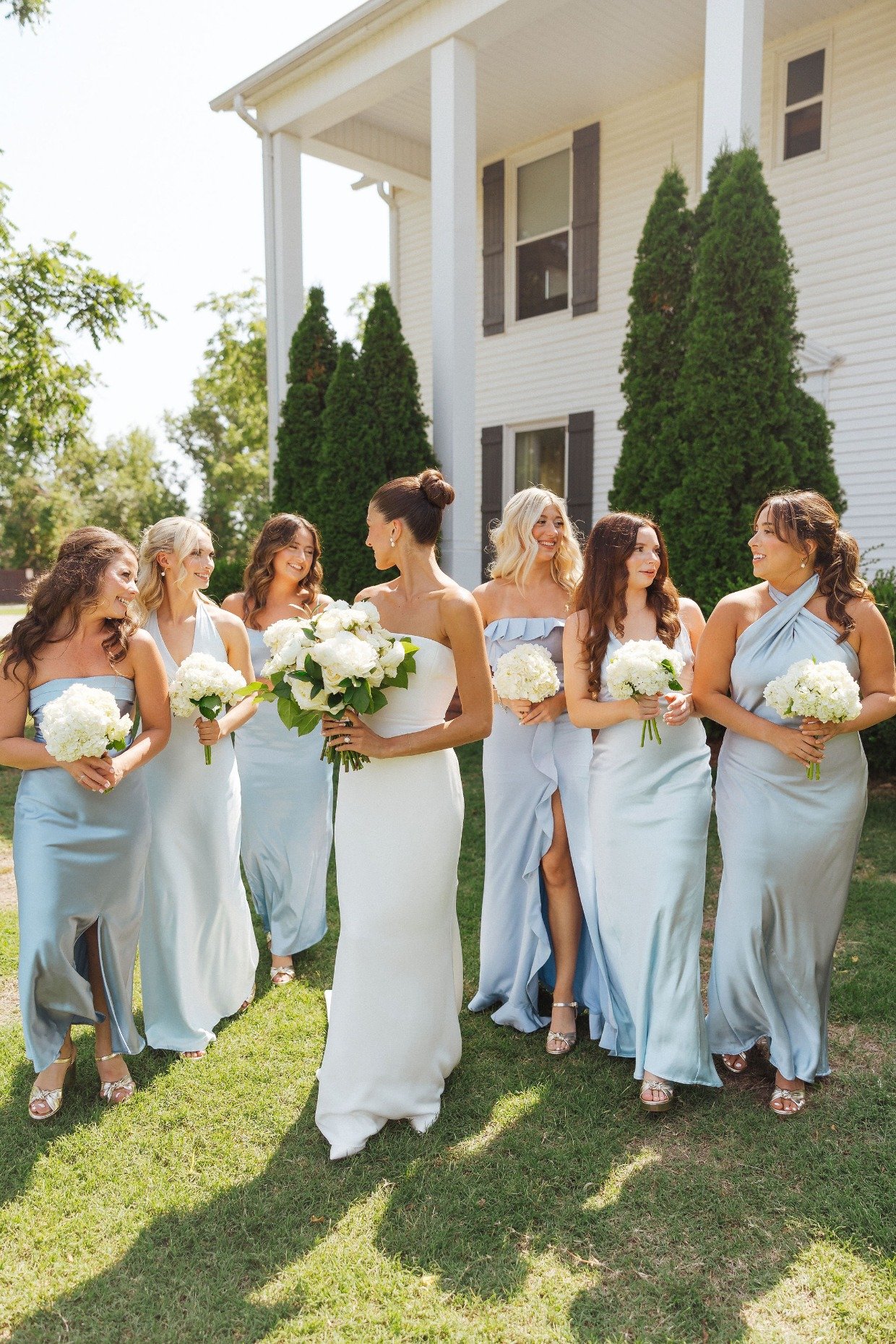 bridesmaids in mix and match pastel blue dresses by with great love