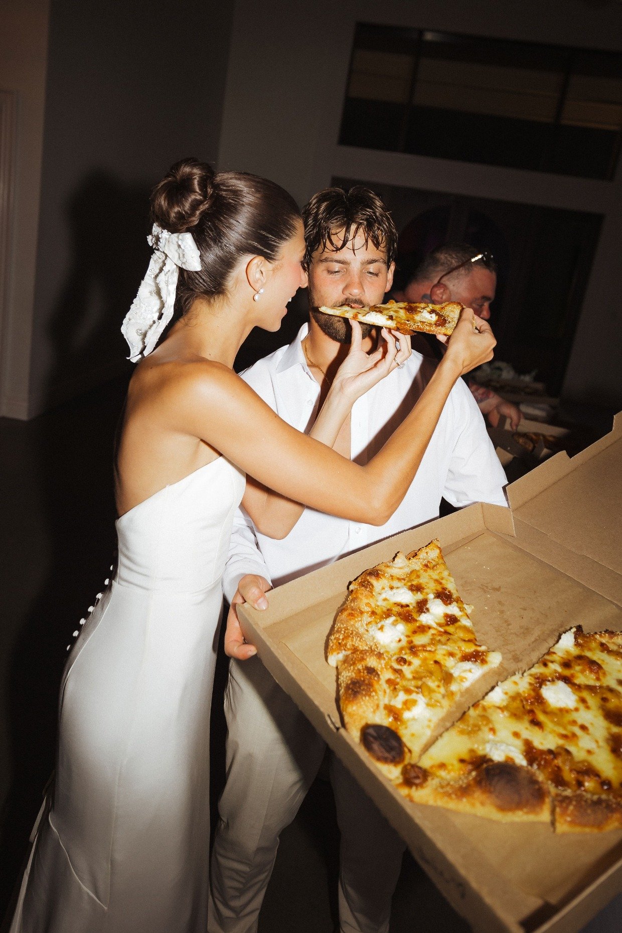 late night pizza break at wedding by with great love