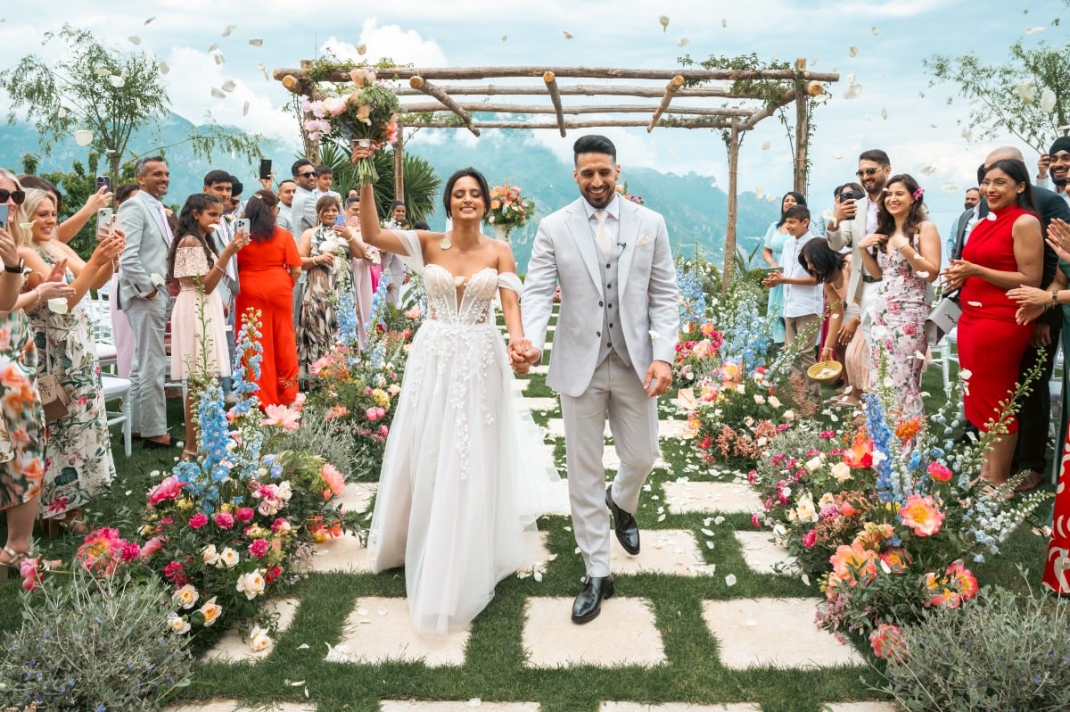 petal toss at colorful wedding ceremony