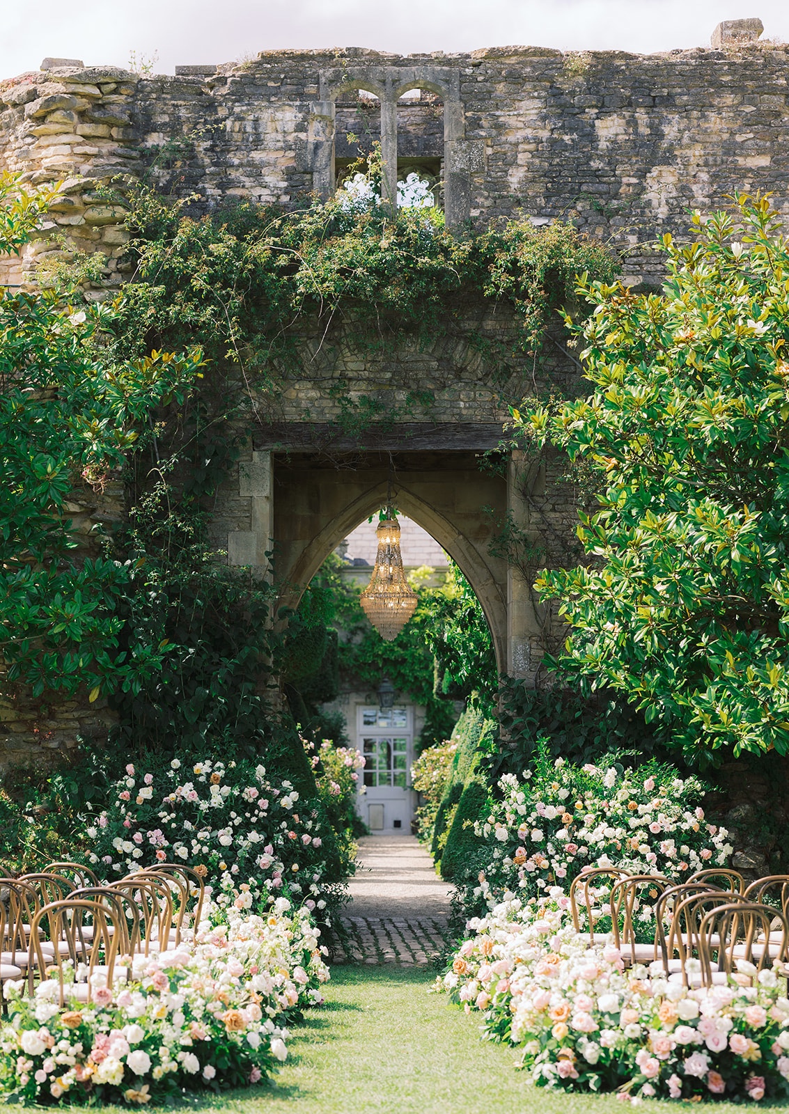 peach and white rose floral installation in garden