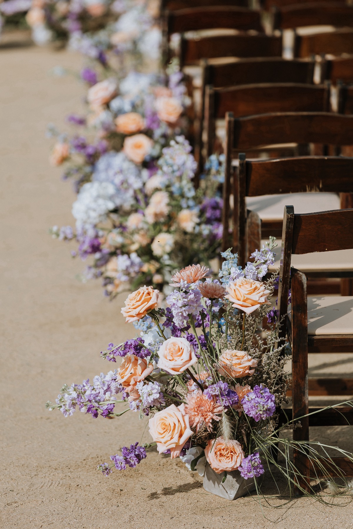 peach and purple ceremony arrangements