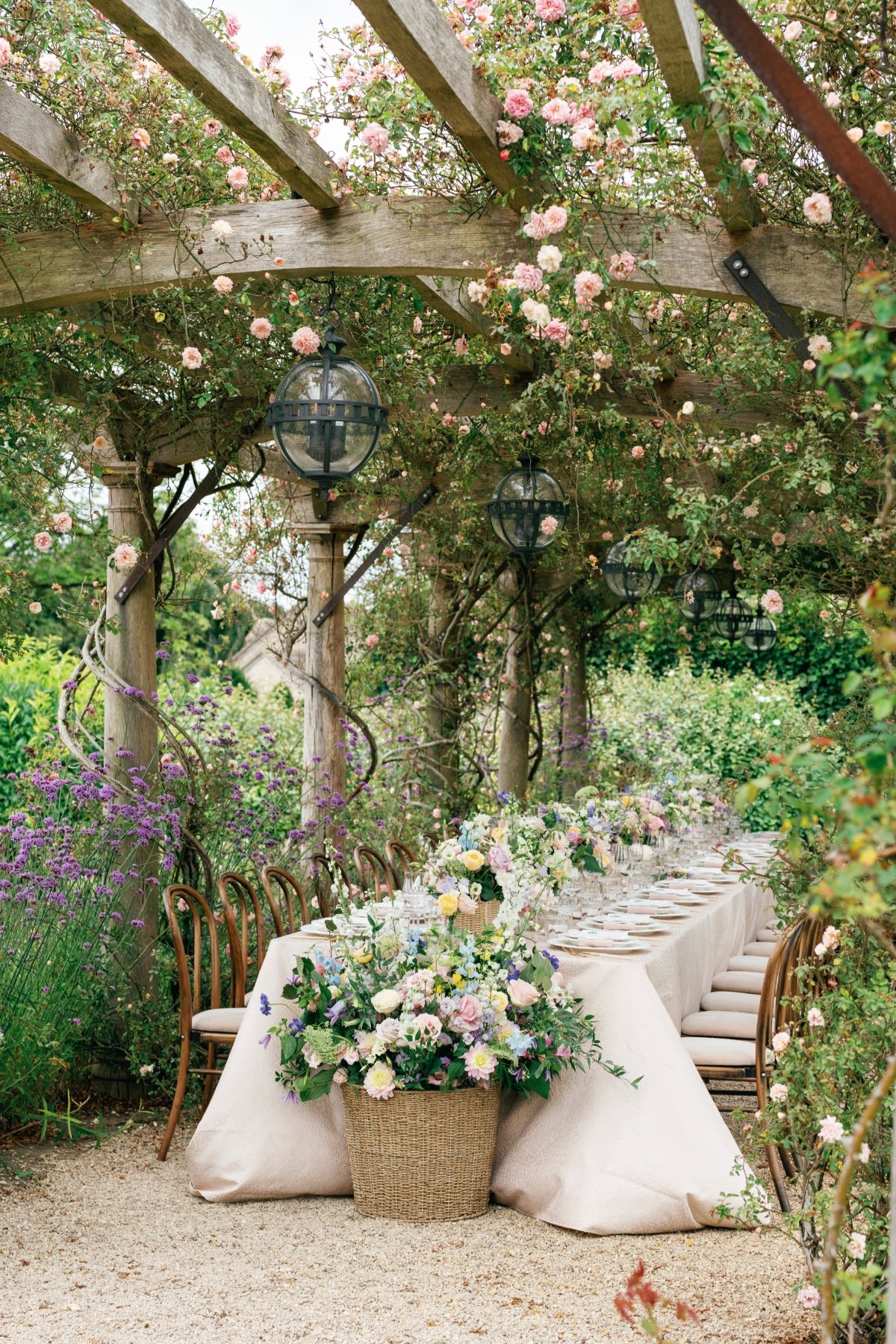 large pastel floral arrangement in wicker basket