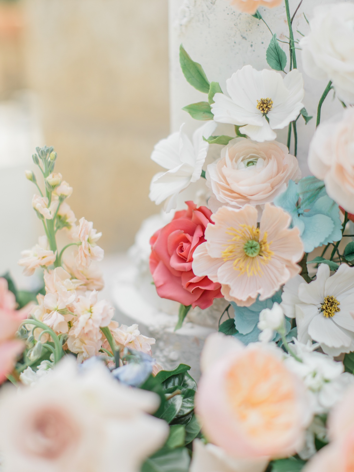 pastel flowers on wedding cake